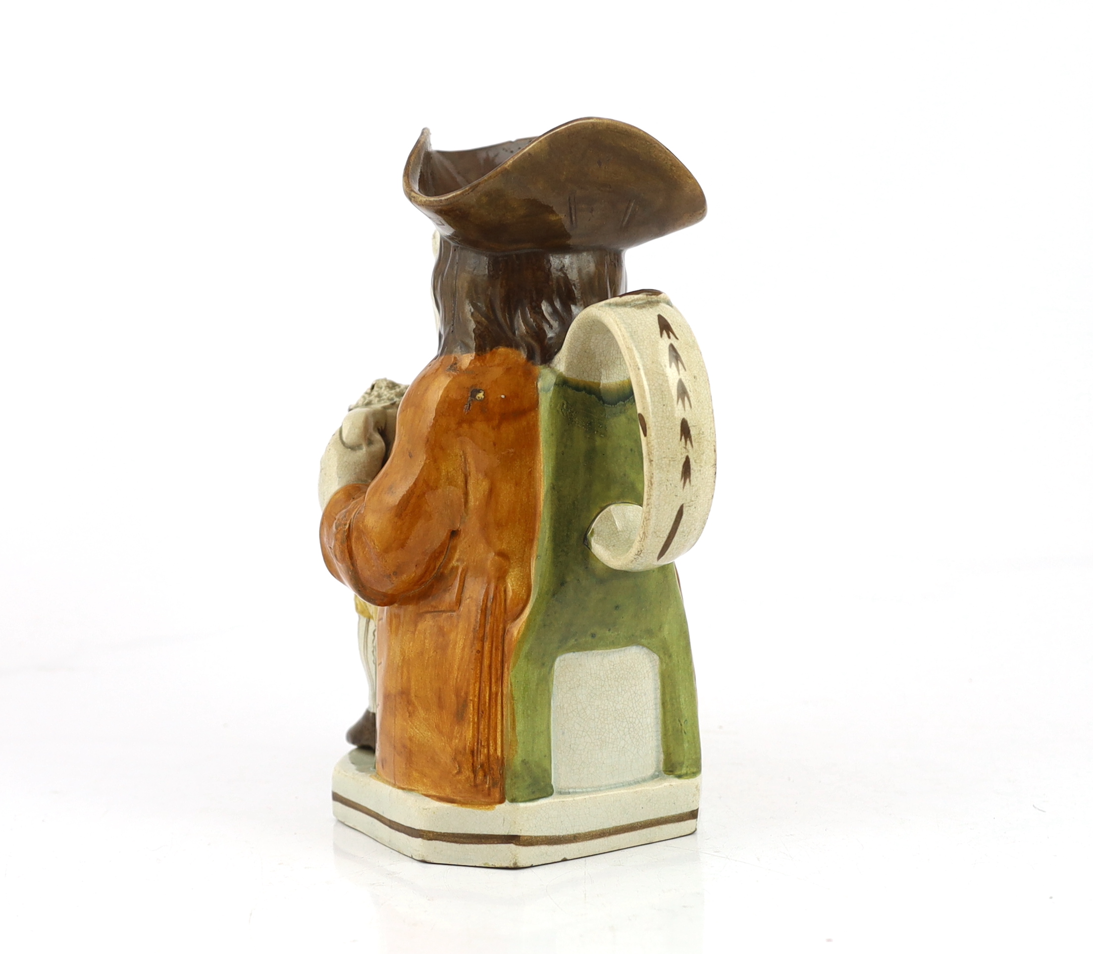 A Staffordshire Prattware Toby jug, c.1790-1800, restoration to front of hat